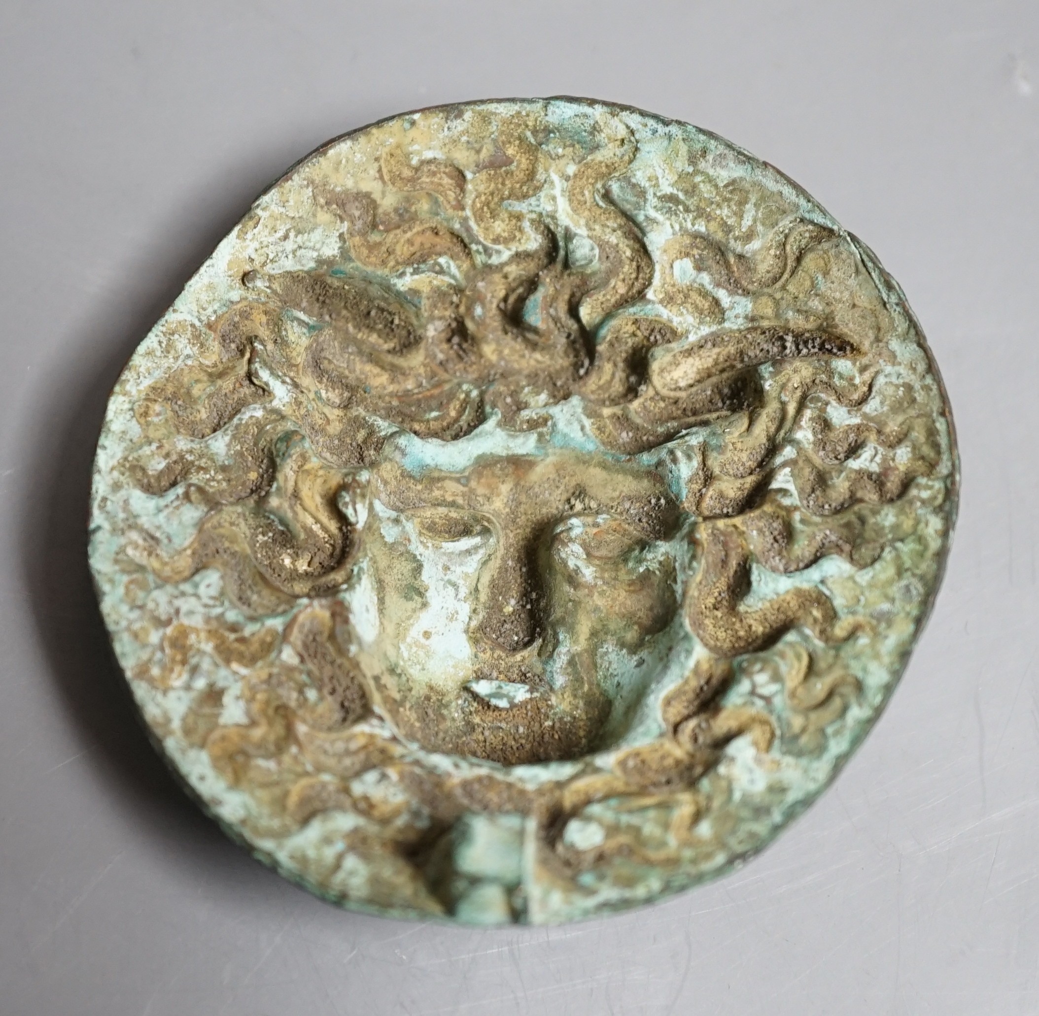 A cast bronze grand tour souvenir phalera of Hermes, 8.5cm diameter